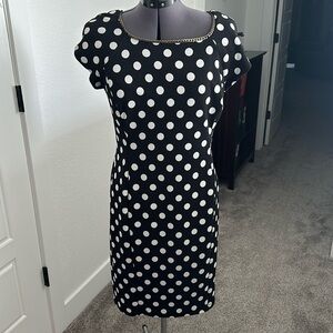 Women’s lined black dress with white polka-dots